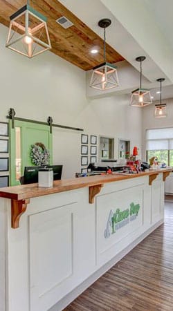 Pet owner and happy dog at Cane Bay Veterinary Clinic in Summerville, SC
